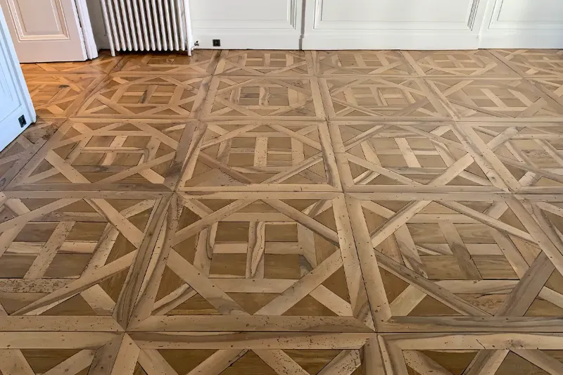 Parquet Versailles vitrifié après rénovation à Lyon